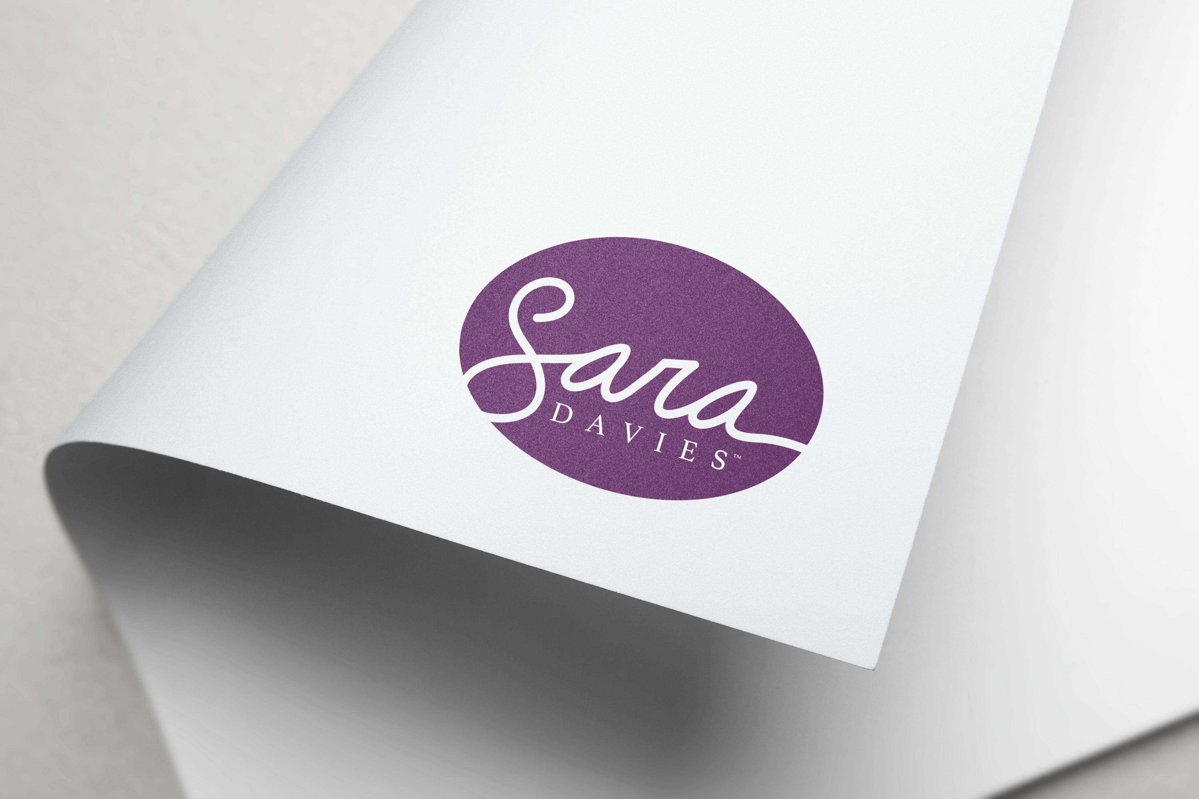 Purple logo design on white paper