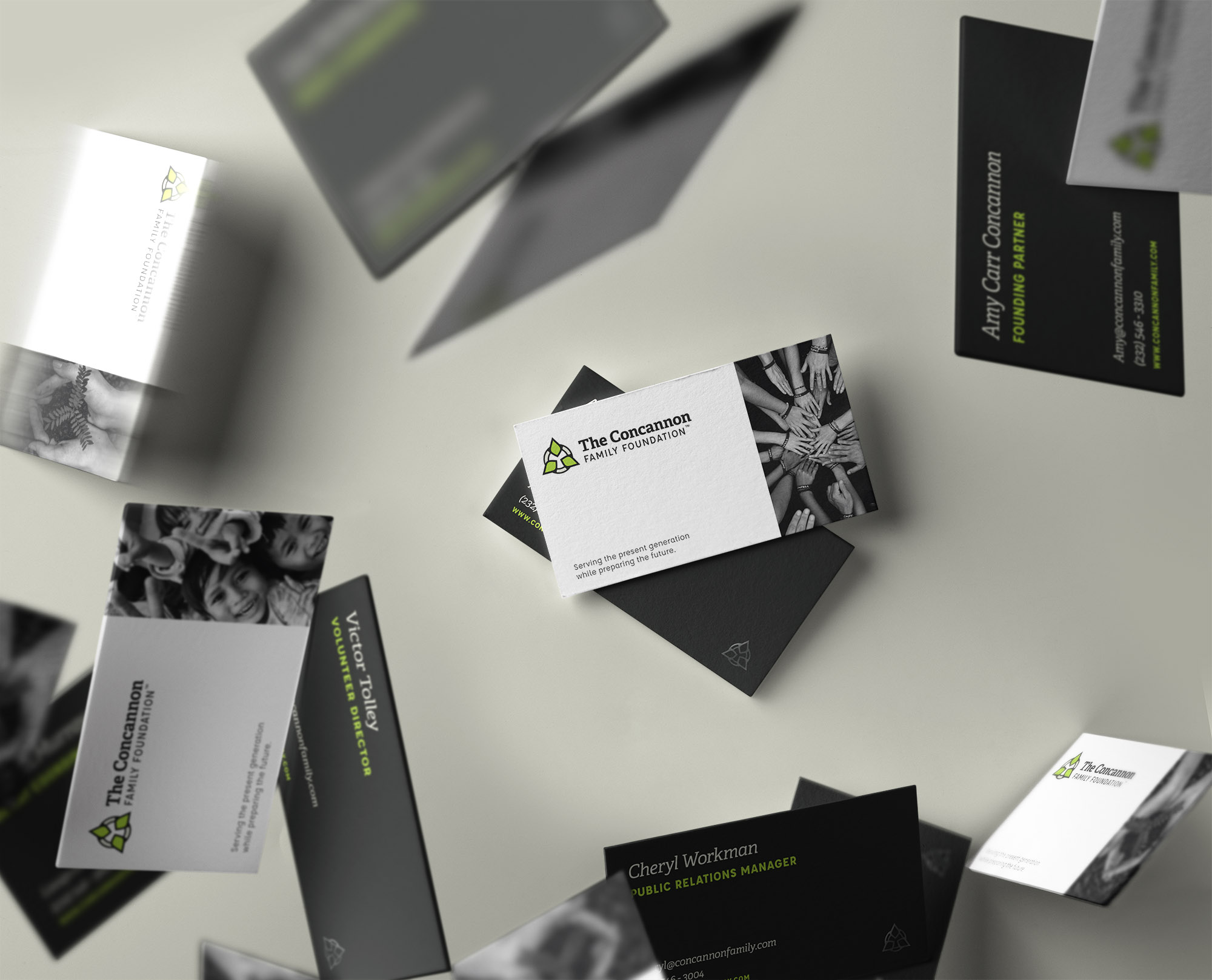 Falling business cards with a logo designed for a non-profit foundation
