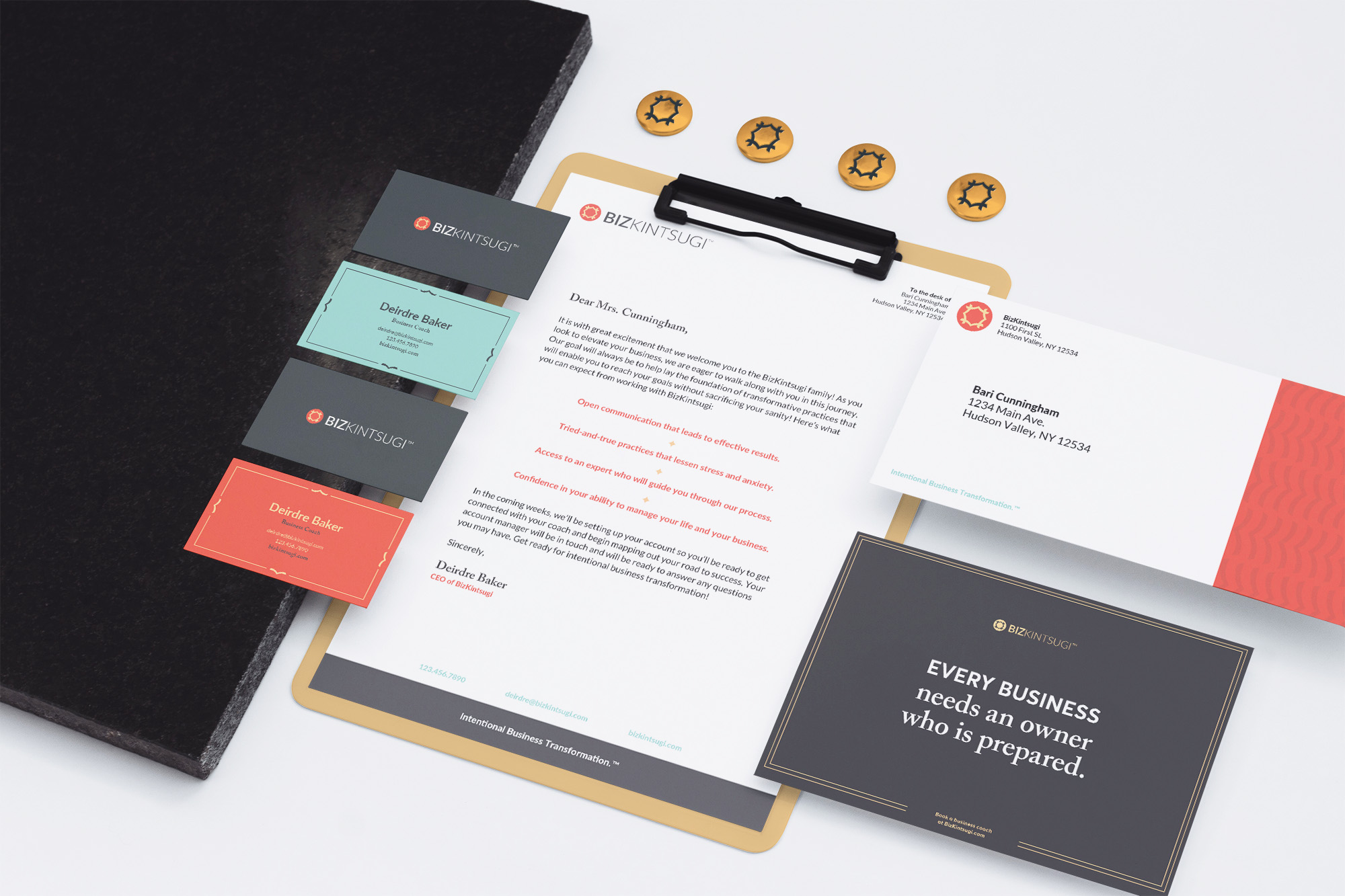 Stationery designs, including letterhead, business cards, and envelope